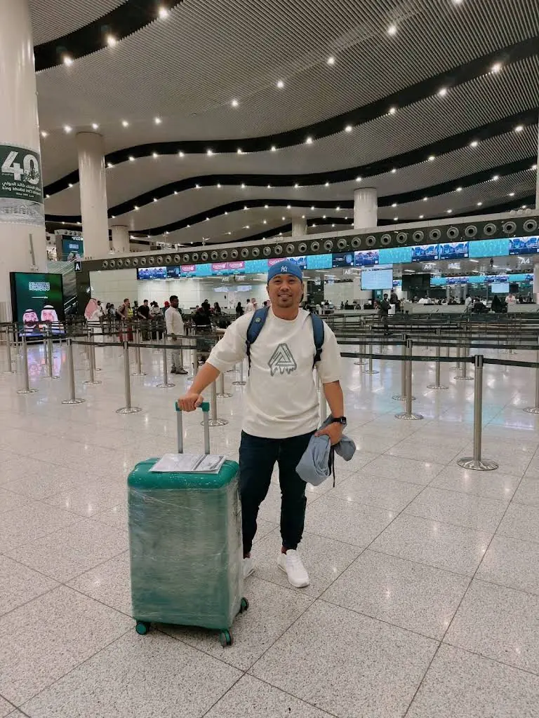 Traveller with a suitcase inside an airport