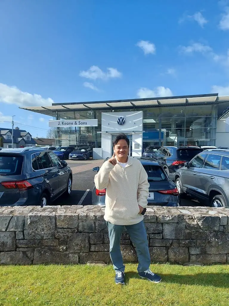 Man outside a motor dealership