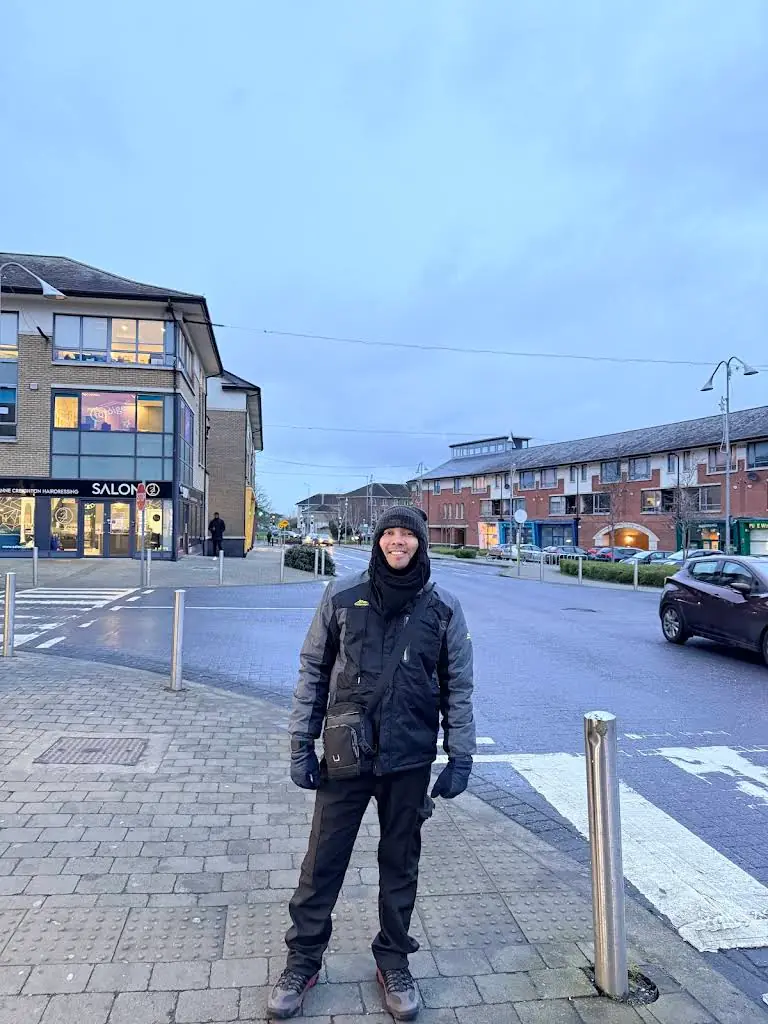 Man smiling on a town street